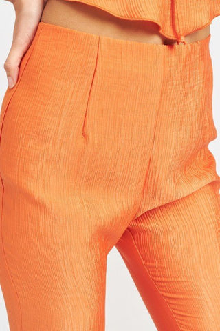 Orange Flare High Rise Pants from Pants collection you can buy now from Fashion And Icon online shop